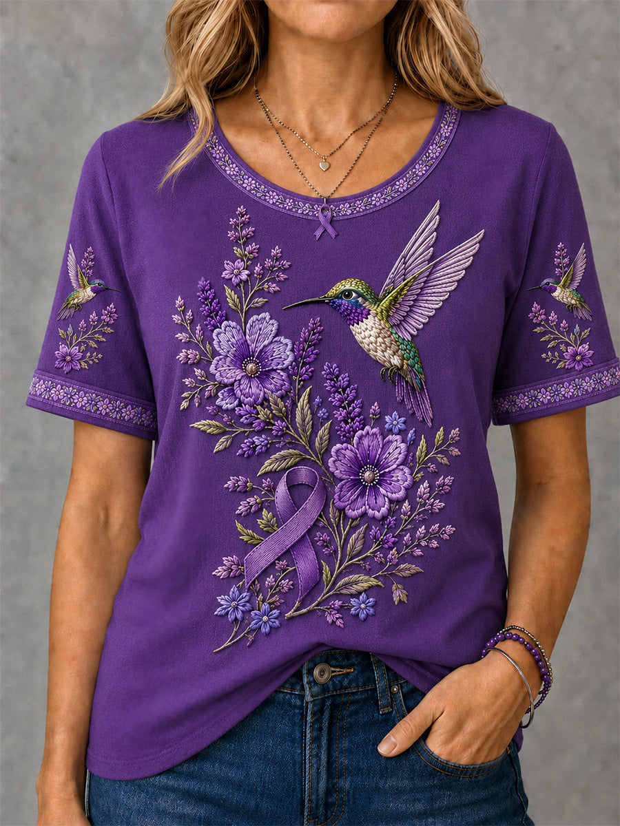 T-shirt för Alzheimers-medvetande med lila blommönster och kolibri, till stöd för drabbade kvinnor