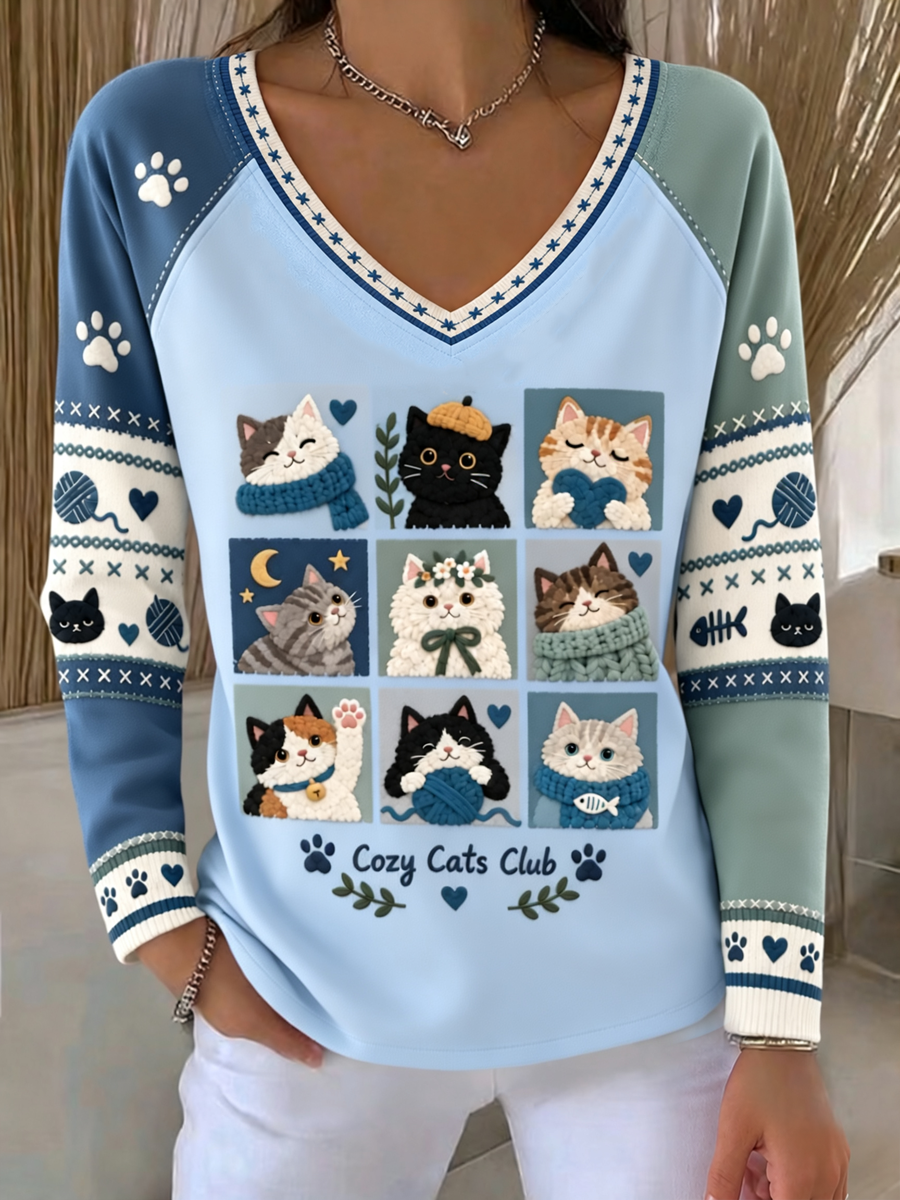 Söt t-shirt för kvinnor med katttryck, långa ärmar och nedsänkta axlar