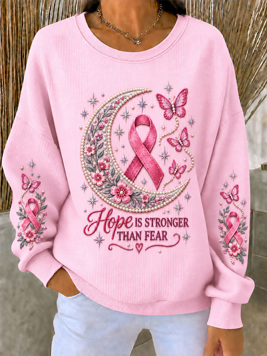 Dammens tröja i ribbstickning med rund hals, rosenbandsmotiv och bröstcancermotiv