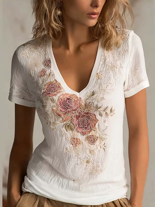 Kvinnlig t-shirt i vardagsstil med tryckt blommigt broderimönster och korta ärmar