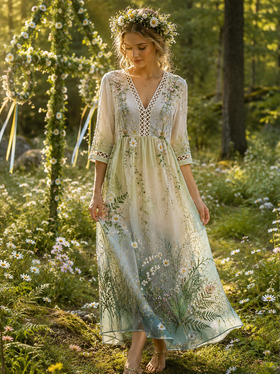 Damklänning med midsommarblommönster, v-ringning och lång ärm
