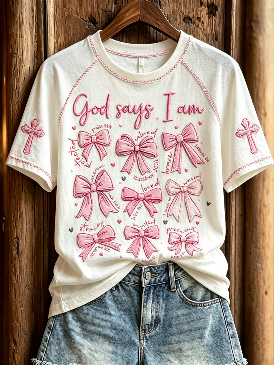 Kvinnors Gud Says I Am Pink Bow Knop & Cross Print kort ärm T-shirt