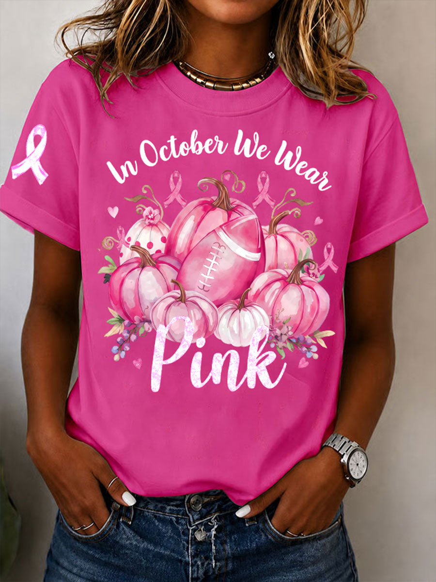 Kvinnors I oktober bär vi rosa T-shirt med korta ärmarna