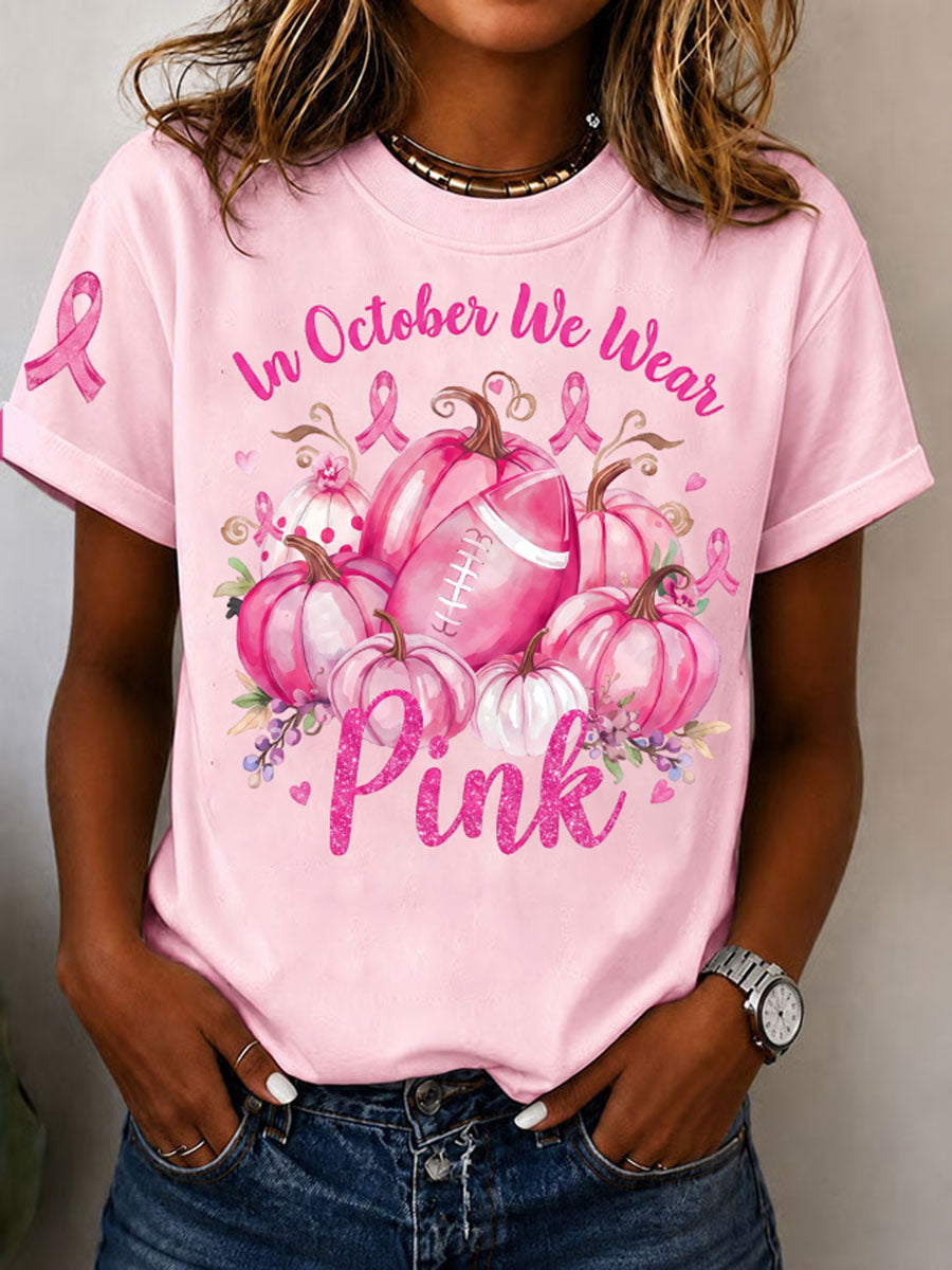 Kvinnors I oktober bär vi rosa T-shirt med korta ärmarna