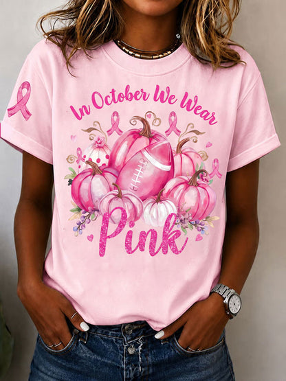 Kvinnors I oktober bär vi rosa T-shirt med korta ärmarna