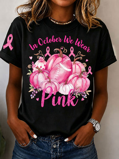 Kvinnors I oktober bär vi rosa T-shirt med korta ärmarna