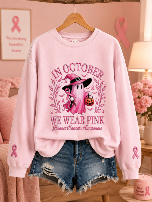 Kvinnors oktoberkläder – rosa sweatshirt med spöktryck, i anslutning till bröstcancerkampanjen