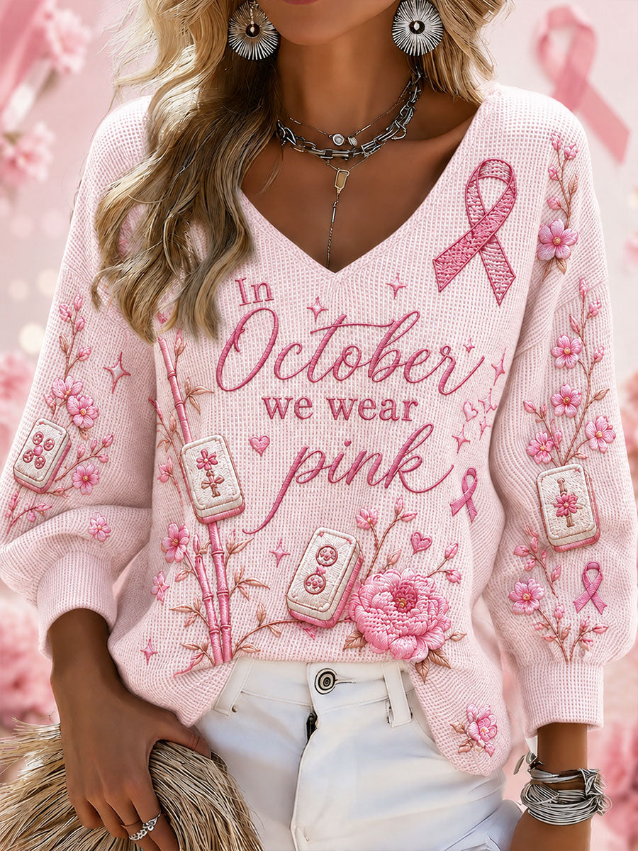 Kvinnliga vajktröjor med texten ”I oktober bär vi rosa” och V-ringning