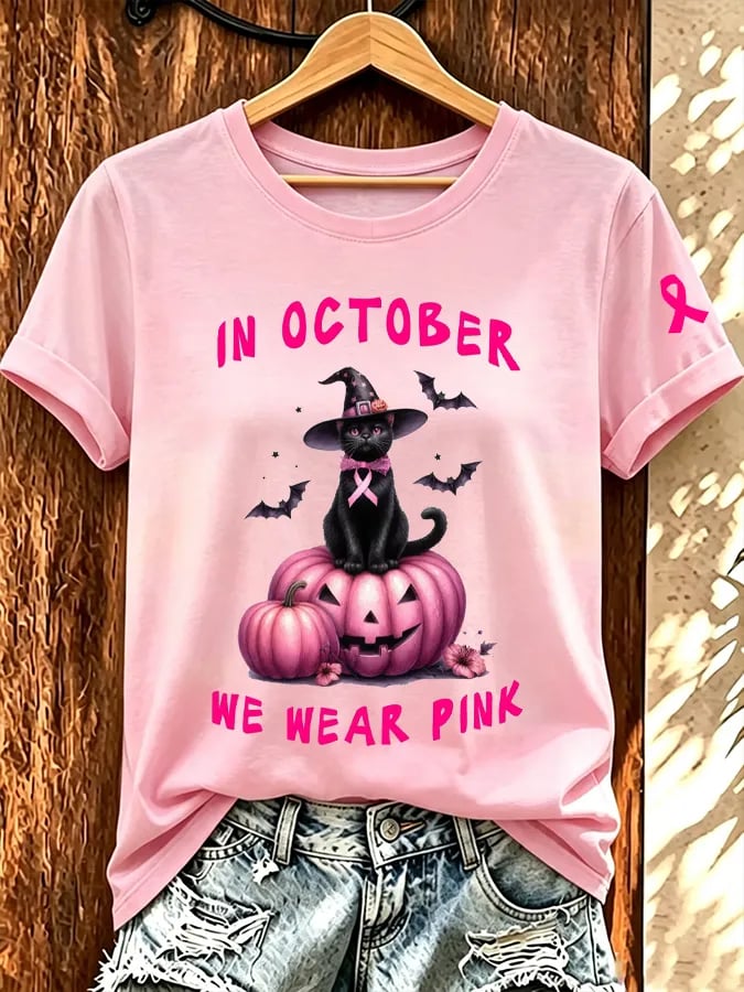 Kvinnors I oktober bär vi rosa T-shirt med korta ärmarna